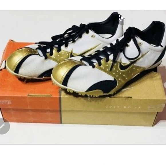nike gold spikes